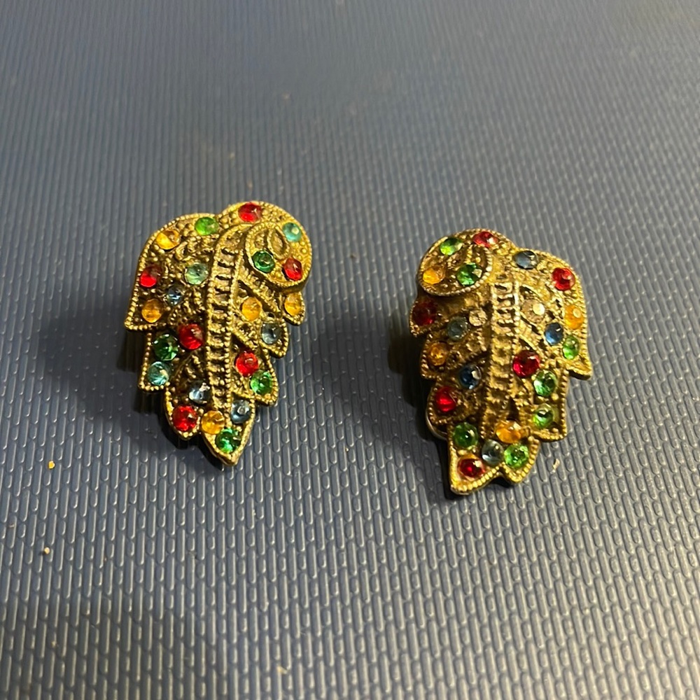 Silver with multicolored stones.